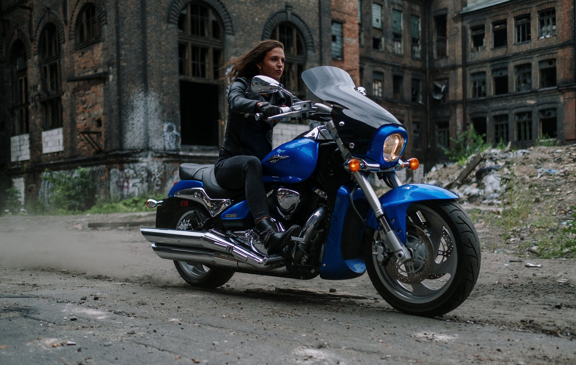 a woman riding a big motorcycle