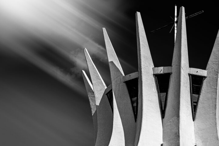 grayscale photo of the steel columns surrounding the roof of cathedral of brasilia in brasilia brazil