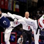 Com apoio do Bolsa Atleta, Henrique Marques conquistou o ouro e seu primeiro título mundial. É o segundo topo do pódio do país no torneio – algo inédito para o Brasil em Mundiais – e a primeira conquista do taekwondo masculino do país em toda a história da competição. Foto: Miriam Jeske/COB